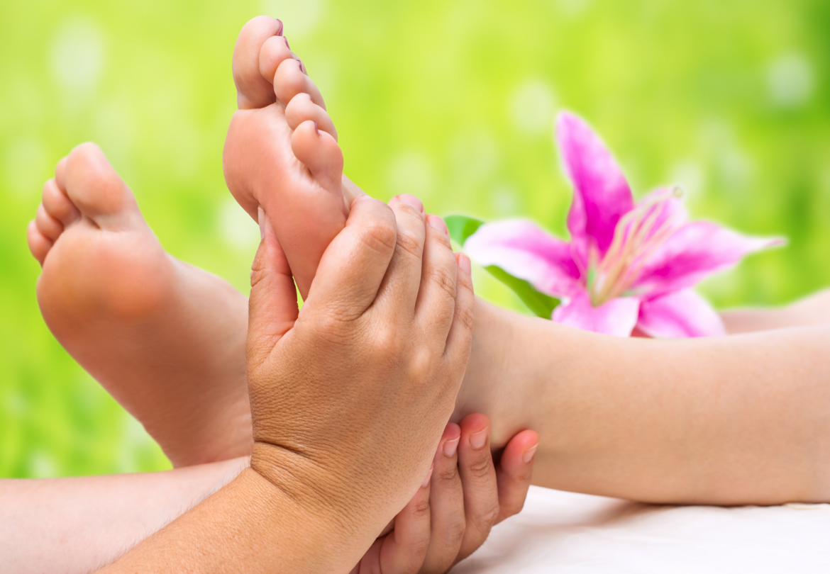 hands doing foot massage